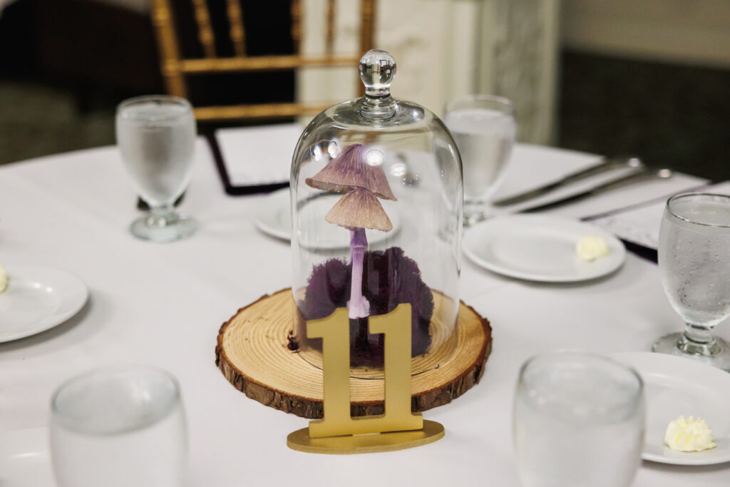 Paper flower table centerpiece with purple mushrooms