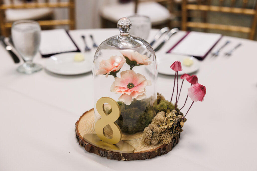 Paper flower table centerpiece with butterfly ranunculus and mushrooms