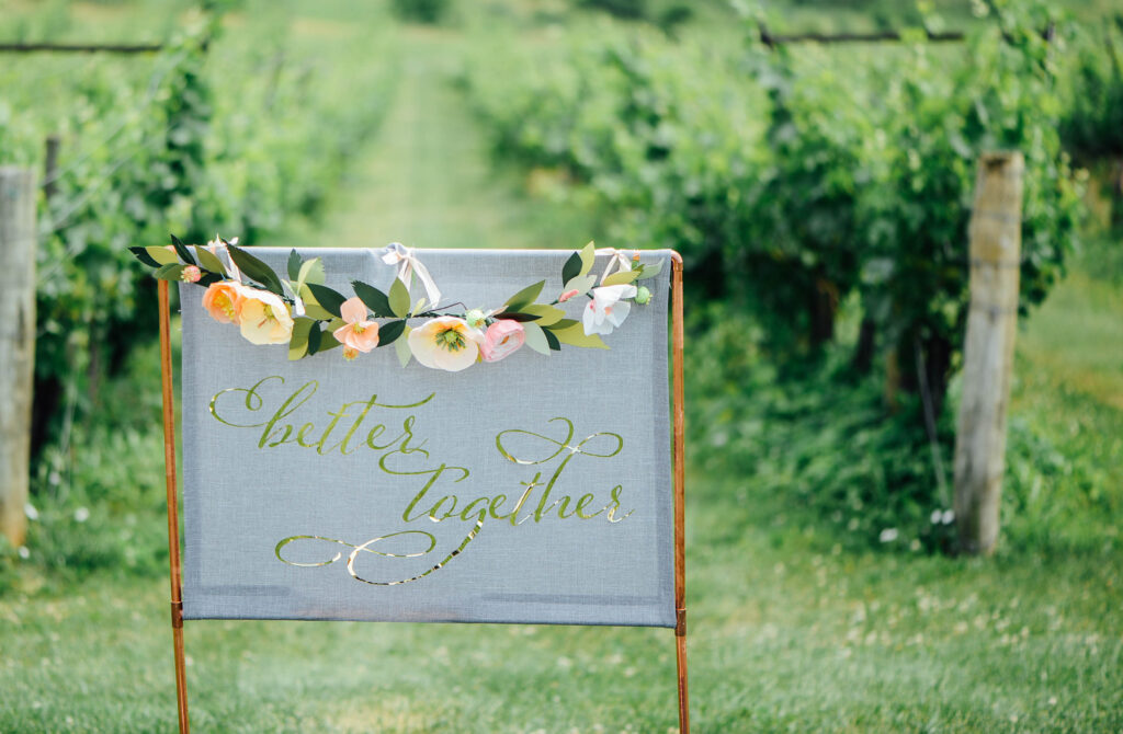 Early paper flower work and wedding signage by Jenn Heller